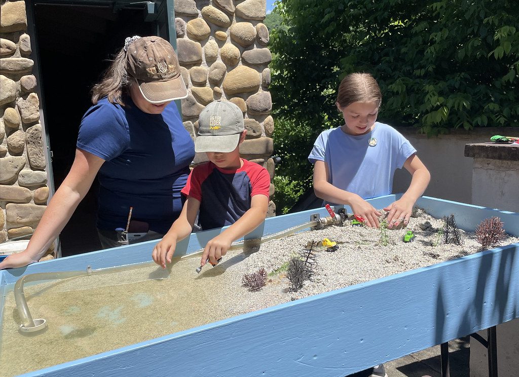 Children building at a sand table